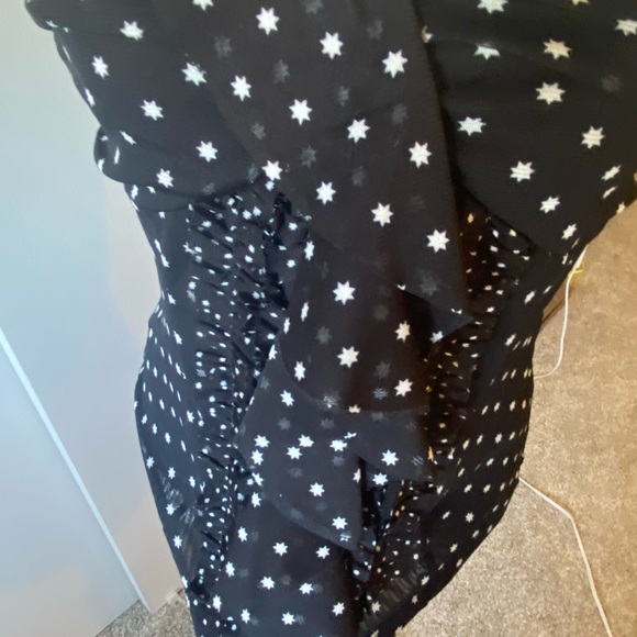 A strapless top with little tiny stars all over it. Ruffled front. - Picture 3 of 7
